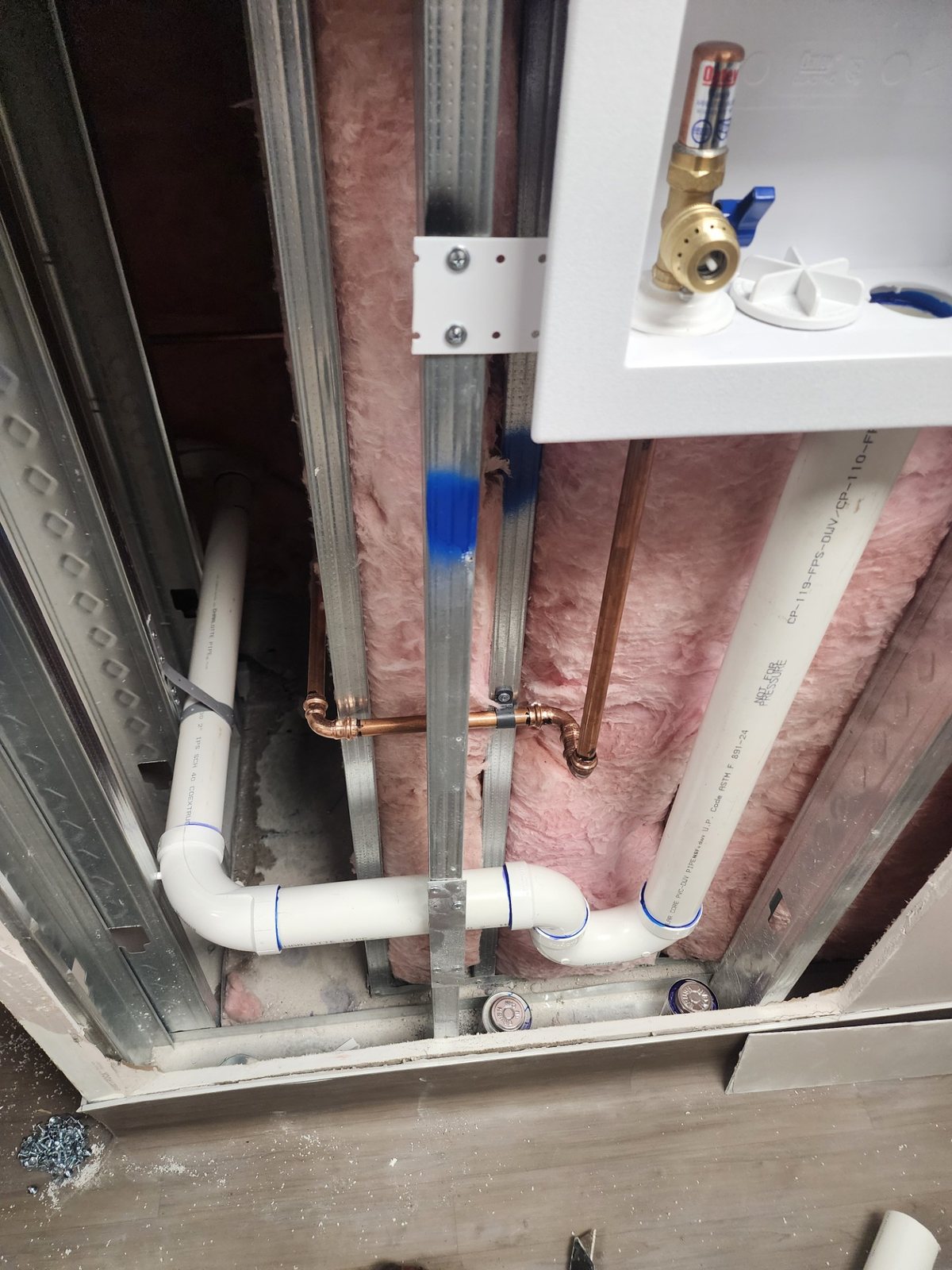 Rough-in supply lines in a new-construction wall cavity with a washing-machine outlet box