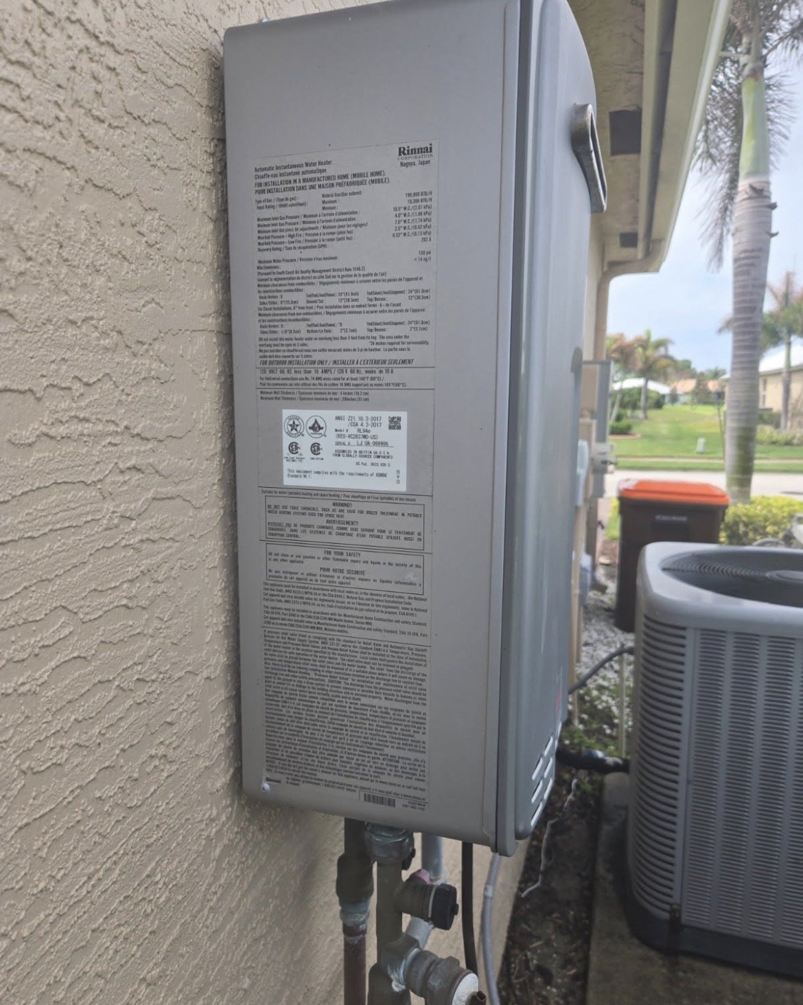 Rinnai tankless water heater mounted on an exterior wall
