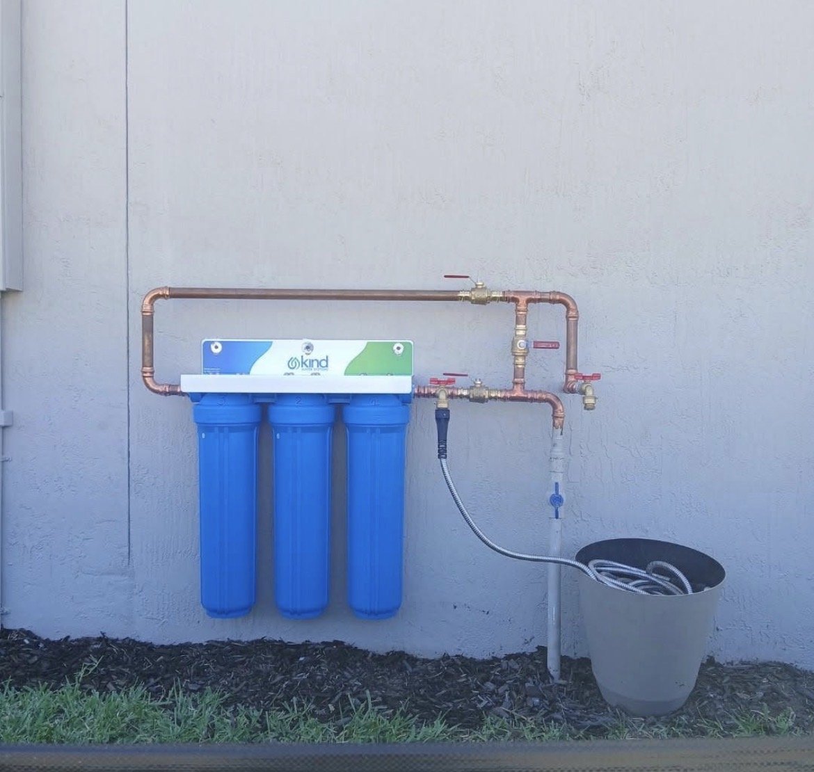 Kind Water Systems whole-house water filtration system with copper piping